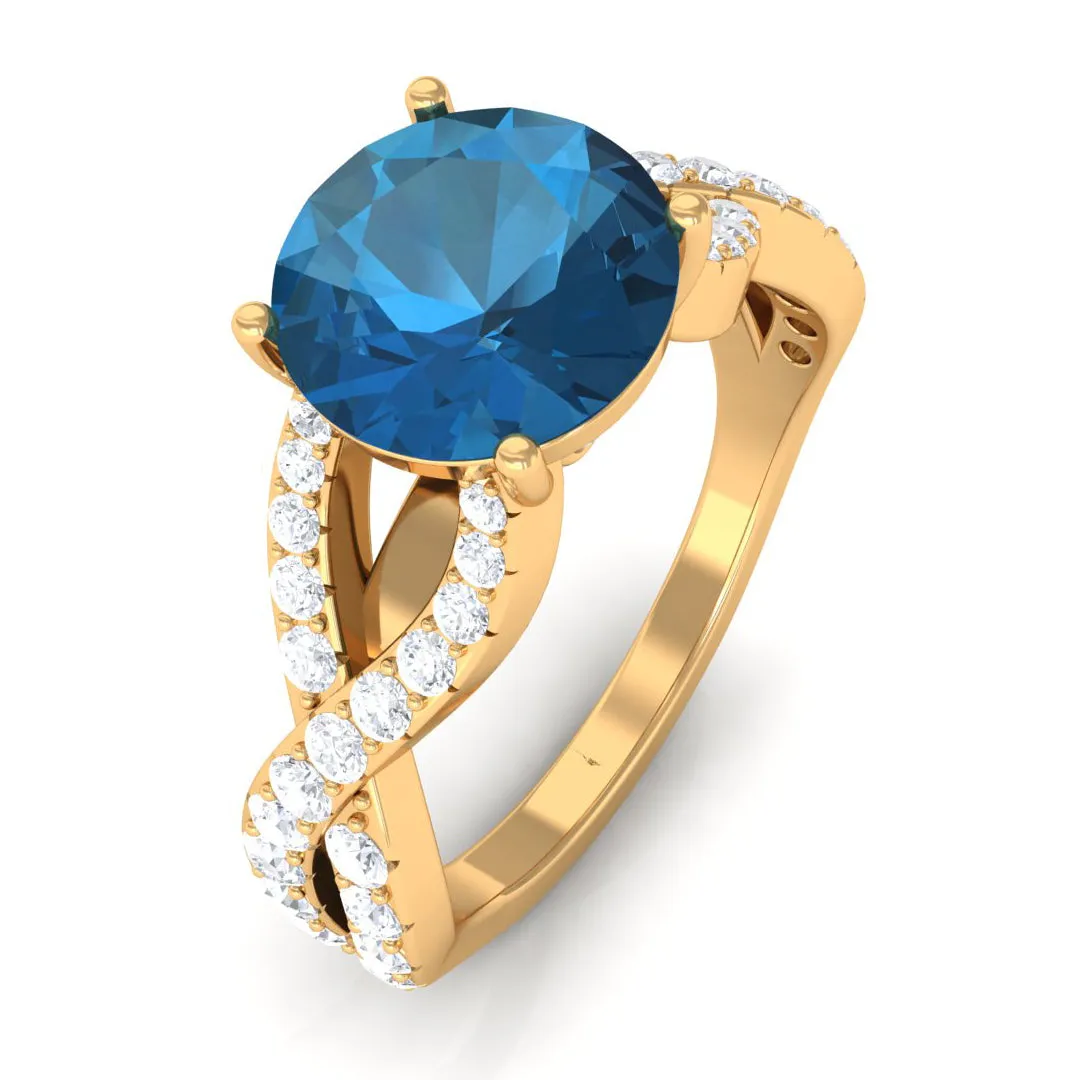 4 Prong Set Solitaire London Blue Topaz Crossover Ring with Diamond Accent