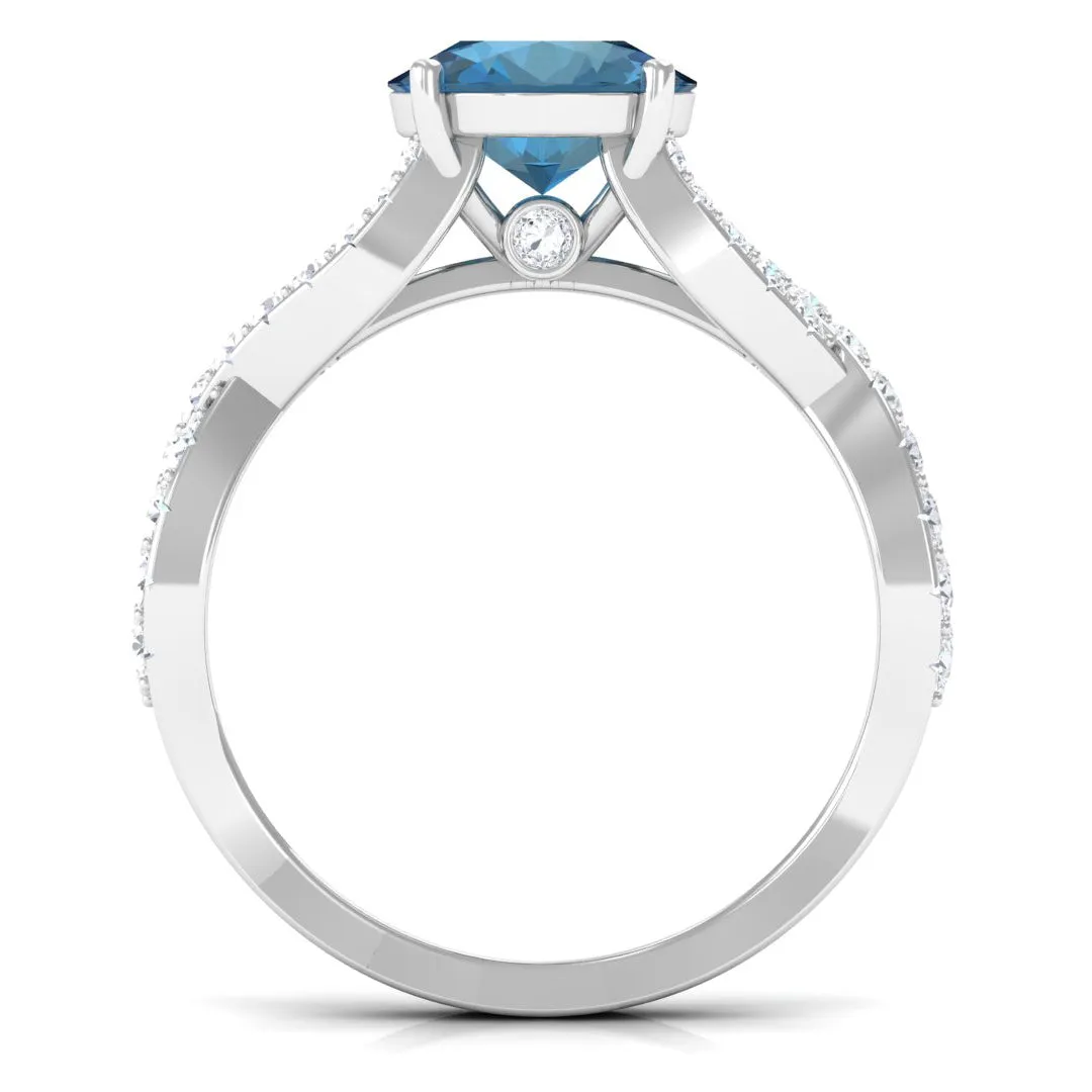 4 Prong Set Solitaire London Blue Topaz Crossover Ring with Diamond Accent