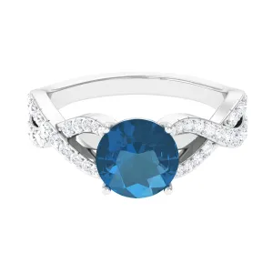 4 Prong Set Solitaire London Blue Topaz Crossover Ring with Diamond Accent