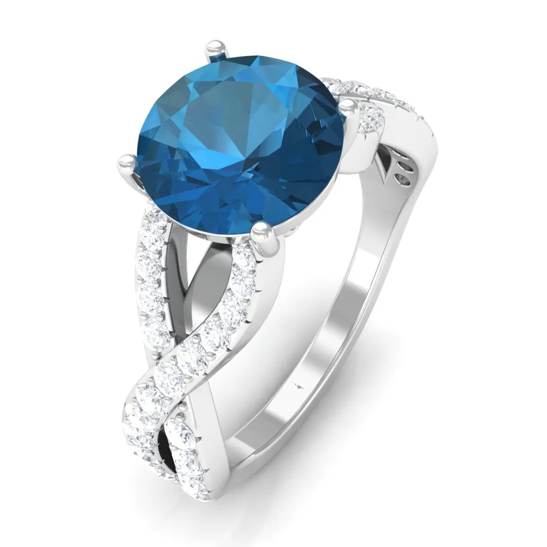 4 Prong Set Solitaire London Blue Topaz Crossover Ring with Diamond Accent